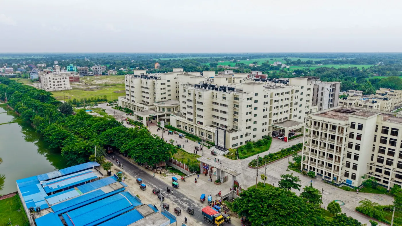 Aerial view of Kushtia Medical College campus in Bangladesh, surrounded by green fields